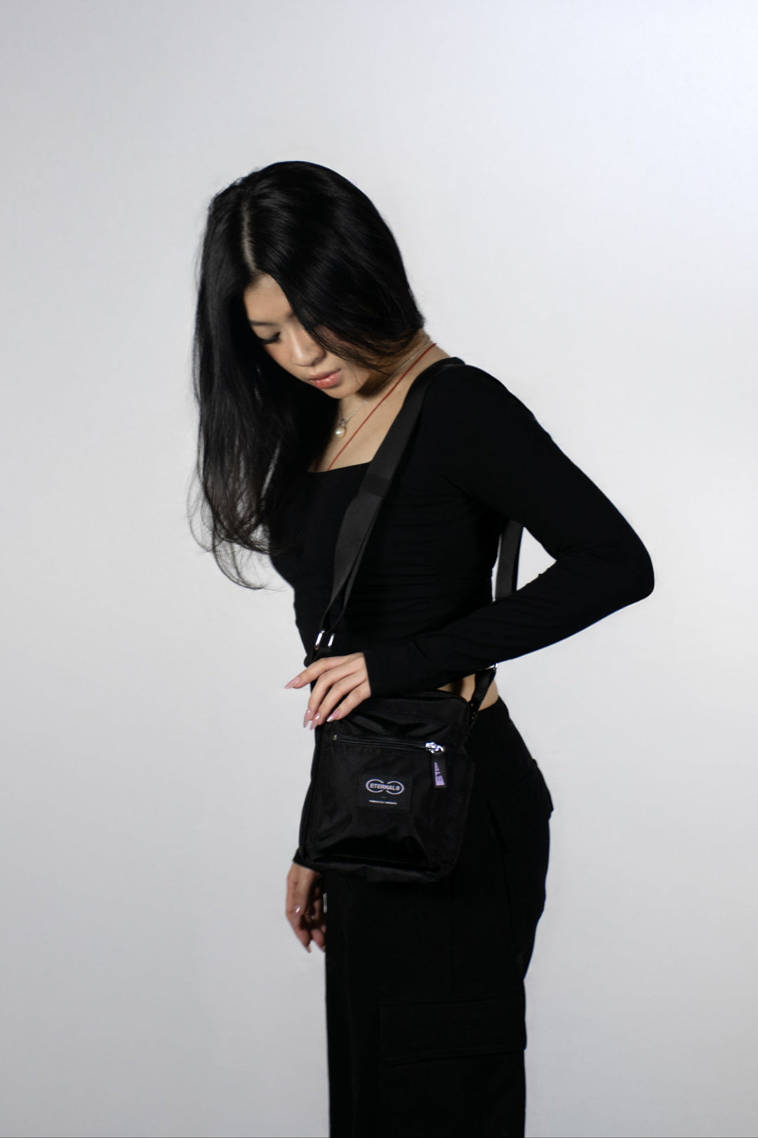 TI CROSS-BODY BAG.